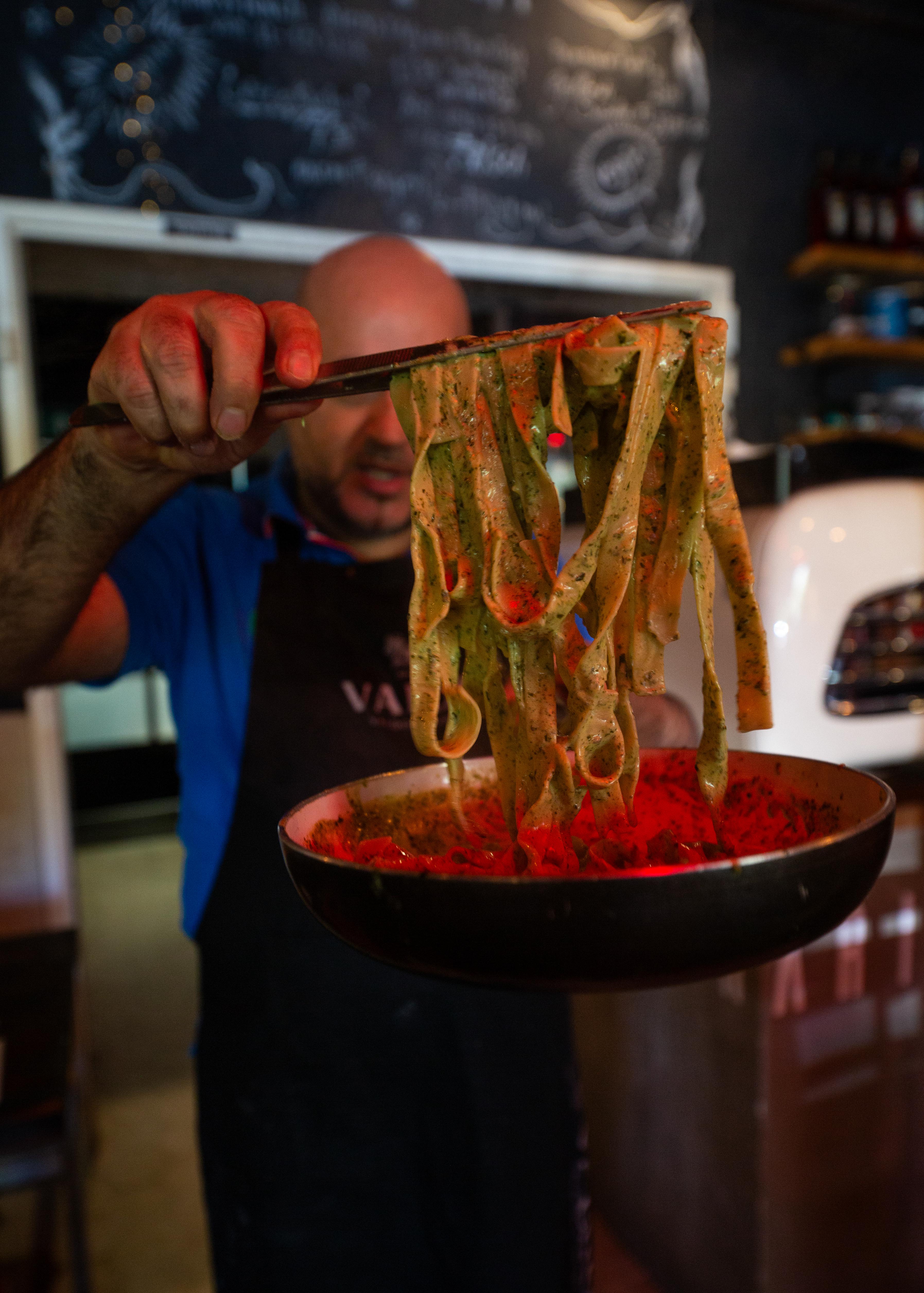 Chef tossing pasta